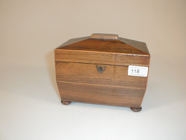 Appraisal: A Regency rosewood sarcophagus tea caddy with string decoration