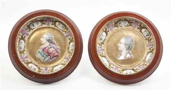 Appraisal: A Pair of Capodimonte Porcelain Plates centered with relief portraits