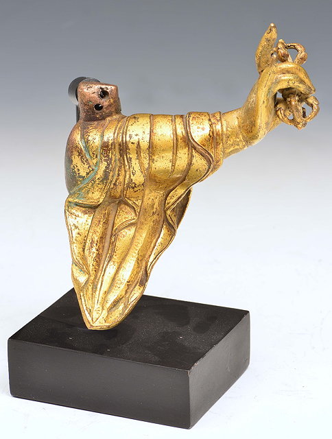 Appraisal: A TIBETAN GILT BRONZE BUDDHA'S ARM with cloth sleeve holding