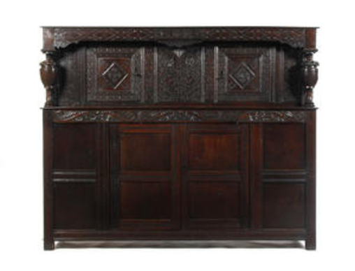 Appraisal: A Charles I and later oak court cupboard the S-scroll