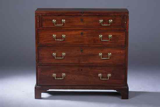 Appraisal: GEORGE III MAHOGANY FOUR-DRAWER CHEST HInged rectangular fold-out top over