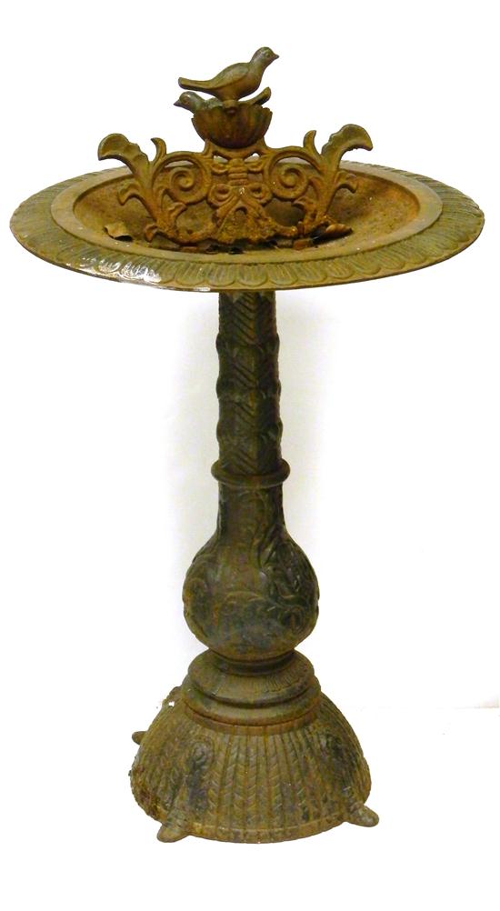 Appraisal: Cast-iron birdbath on shaped pedestal floral and vegetal decoration two