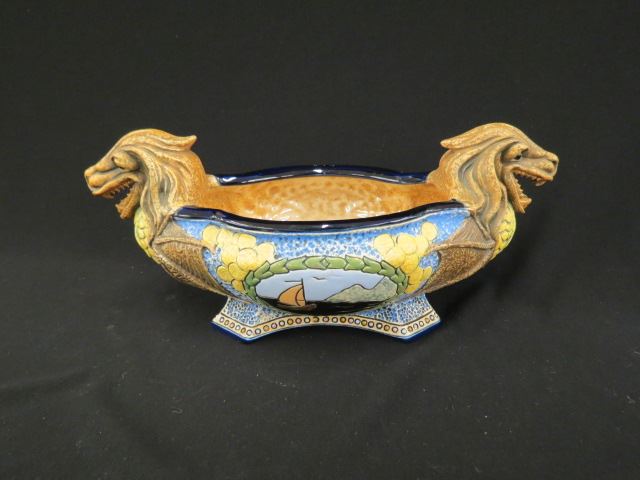 Appraisal: Czechoslovakia Art Pottery Centerpiece or Planter figural dragon ends medallion