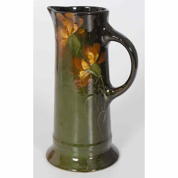 Appraisal: Weller Brown Glaze Pottery Pitcher American th century a brown