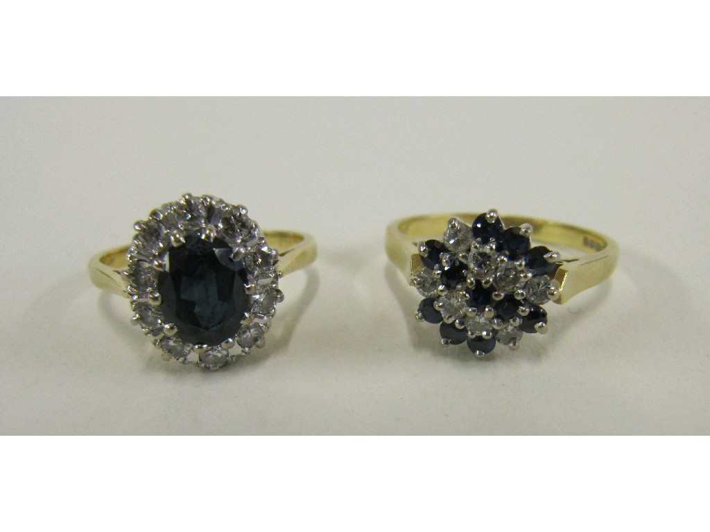 Appraisal: Lot comprising two ct gold sapphire and diamond cluster rings