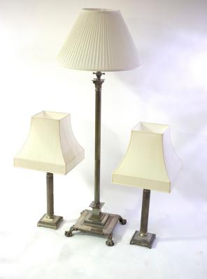 Appraisal: A silvered brass Corinthian column telescopic standard lamp and a