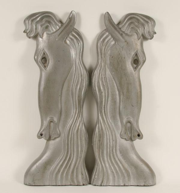 Appraisal: Pair Art Deco carved wood horse head wall sculptures stylized