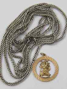 Appraisal: A ct gold St Christopher approx gram together with a