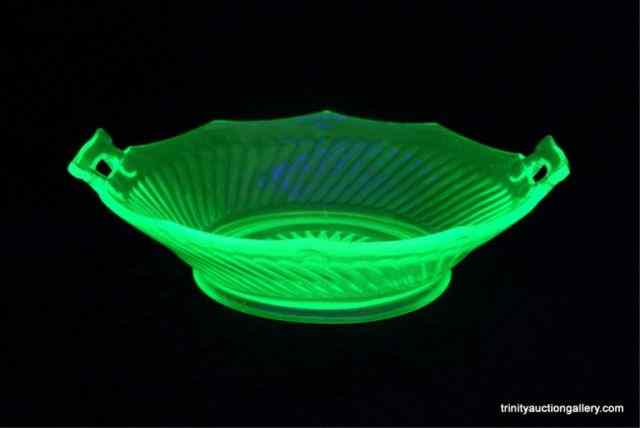 Appraisal: c Depression Vaseline Glass Serving BowlIn the Twisted Optic'' pattern