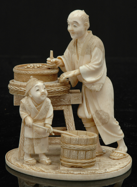 Appraisal: A JAPANESE IVORY FIGURAL GROUP Meiji Period Depicting a street