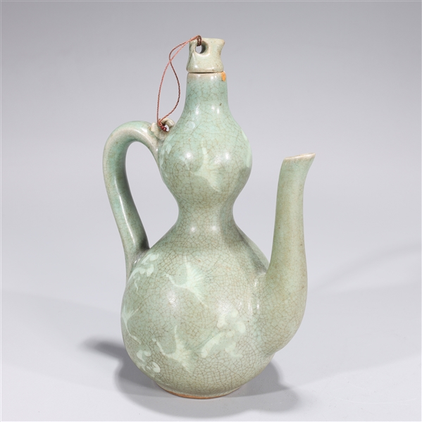 Appraisal: Korean crackle glazed celadon ceramic covered ewer with bird designs