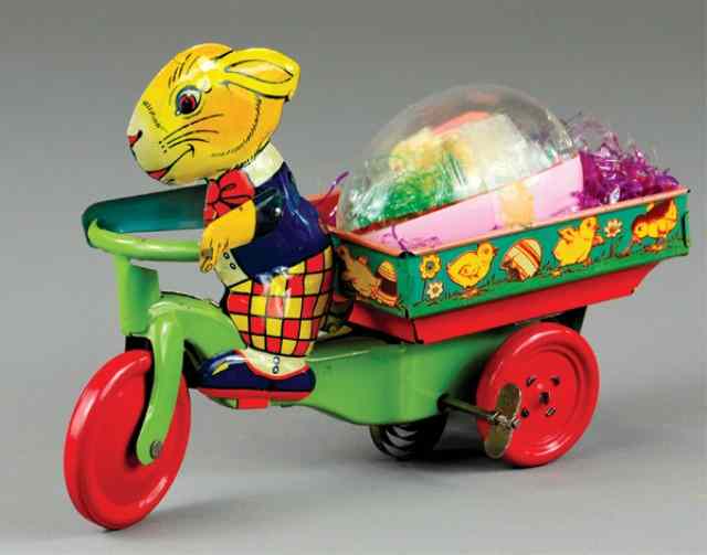 Appraisal: RABBIT RIDING EASTER CART Lithographed tin very colorful possible Chein