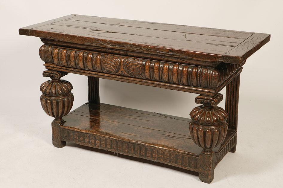 Appraisal: AN ELIZABETHAN STYLE OAK SIDE TABLE the rectangular three plank