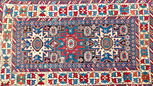 Appraisal: KUBA Antique Caucasian rug in Lesghi star design in reds