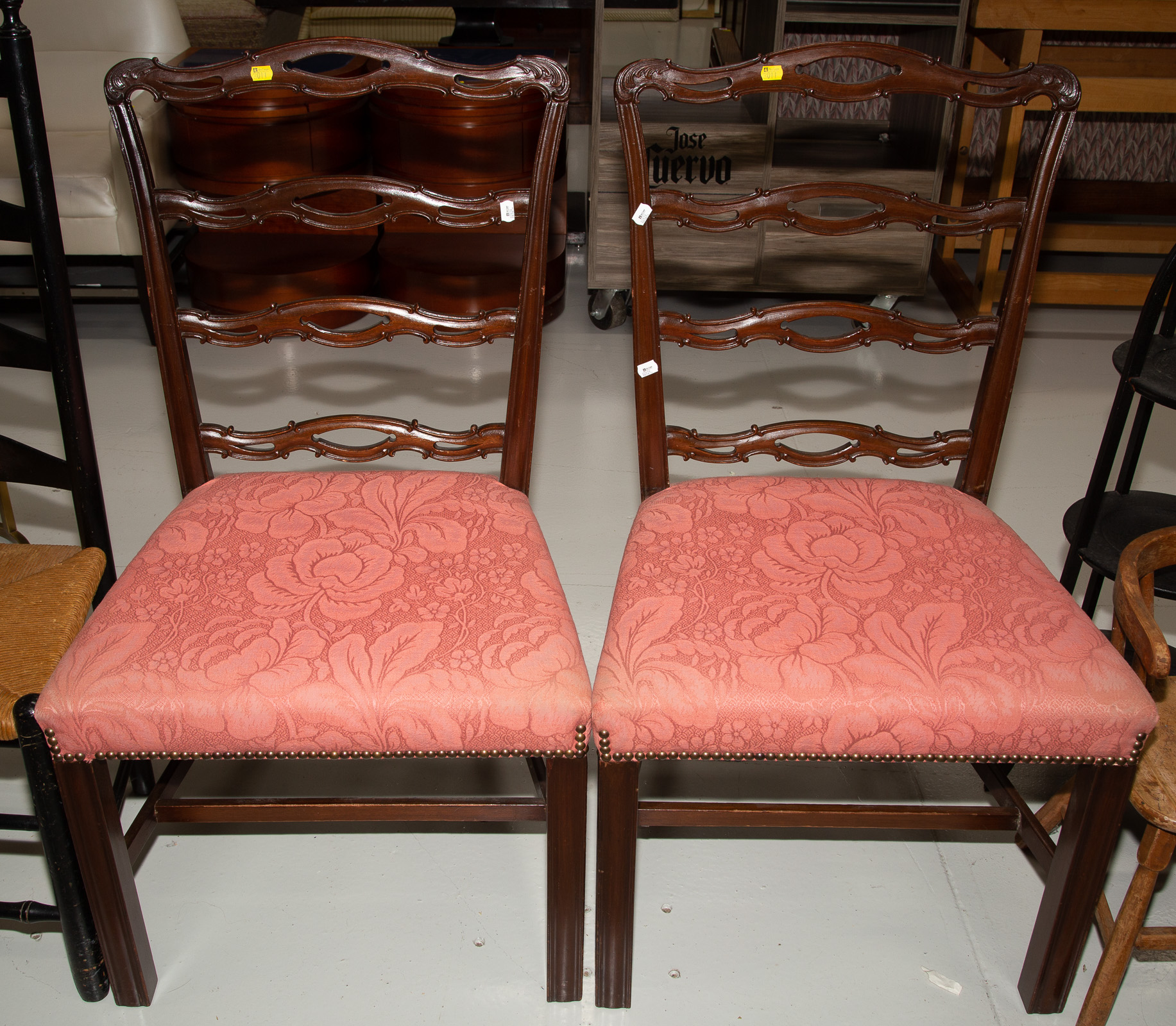 Appraisal: A PAIR OF CHIPPENDALE STYLE MAHOGANY CHAIRS Bench made with