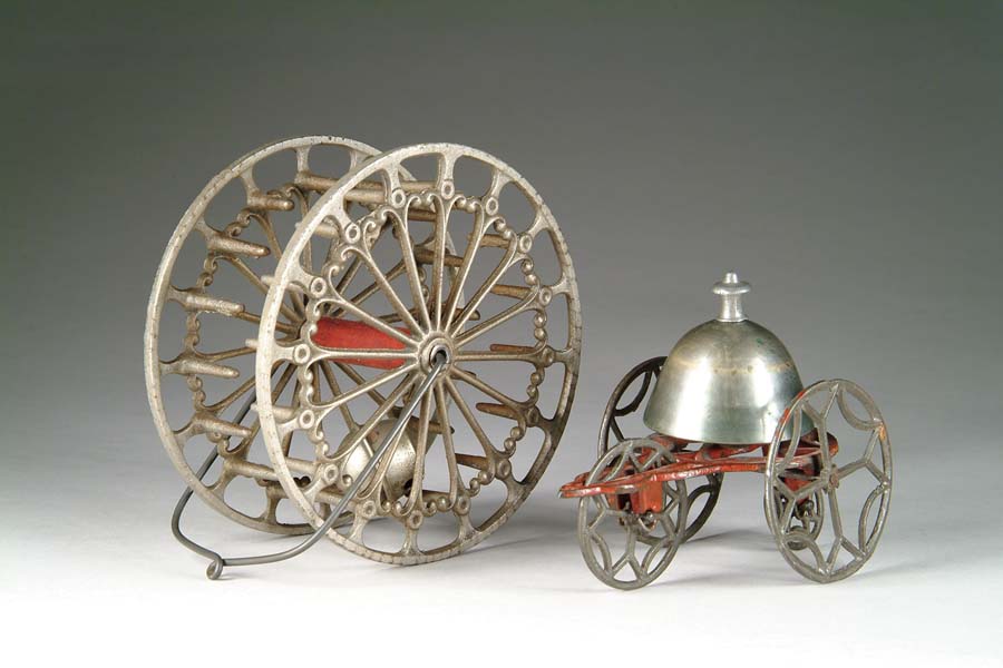 Appraisal: FOUR-WHEELED BELL TOY WITH A FANCIFUL REVOLVING BELL TOY Of