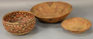 Appraisal: Three coiled Indian baskets each with decoration largest dia in