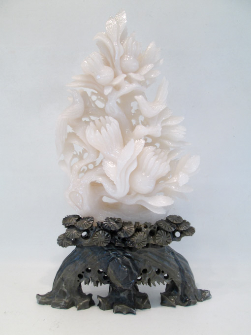 Appraisal: CHINESE CARVED HARDSTONE TREE depicting birds in a flowering white