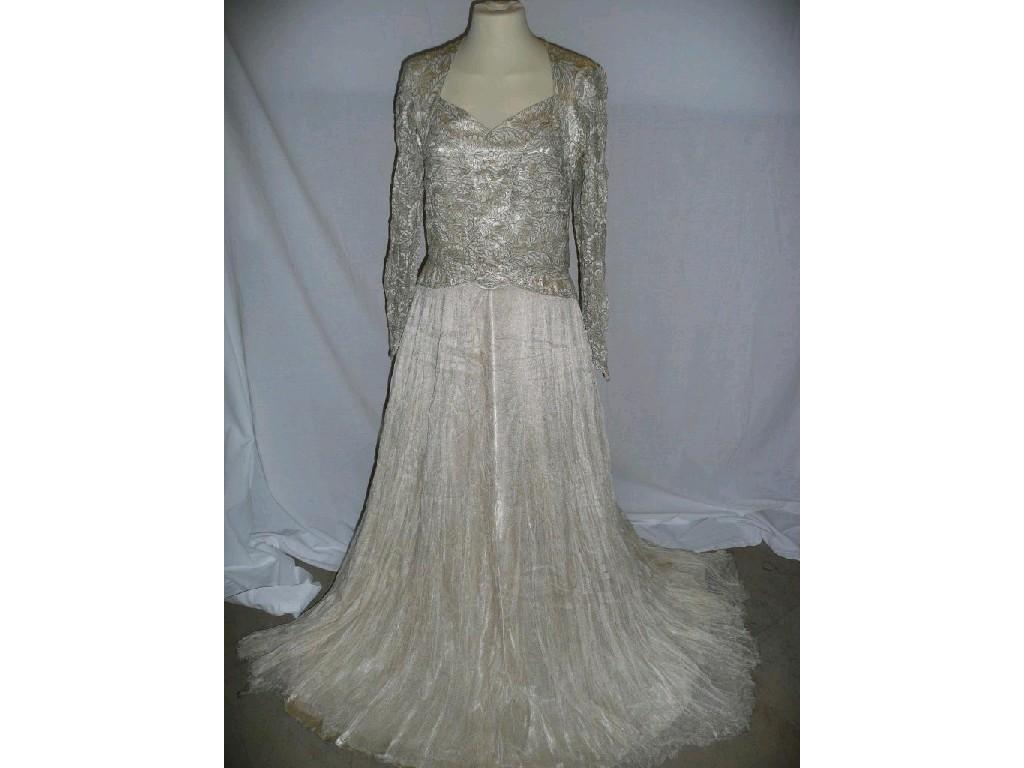 Appraisal: A vintage wedding dress with long sleeves with some satin