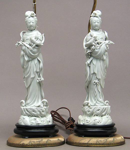 Appraisal: A pair of Dehua porcelain maidens The pair in mirror