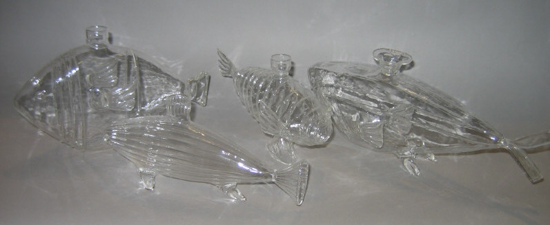 Appraisal: FOUR CLEAR GLASS FISH VASES l - Estimate -