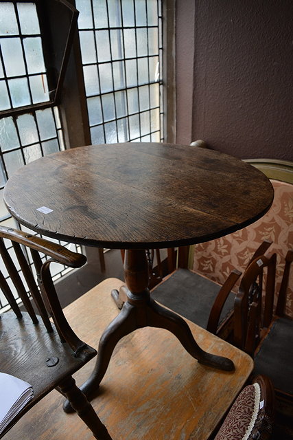 Appraisal: A George III oak tilt top tablewith circular top on