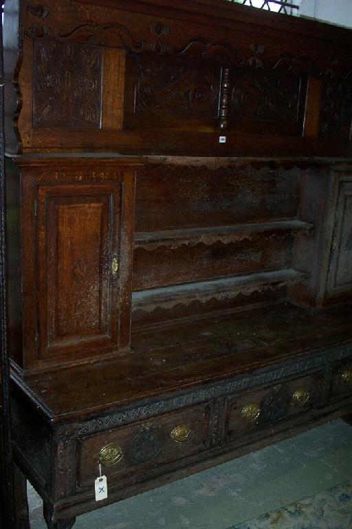 Appraisal: A Georgian and later oak dresser the base fitted with