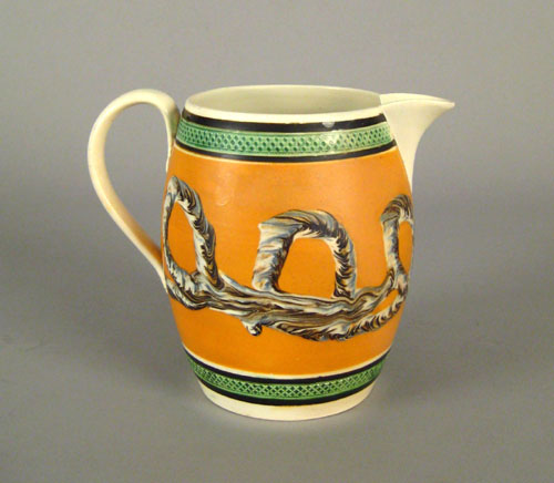 Appraisal: Mocha pitcher th c with earthworm decoration on a yellow