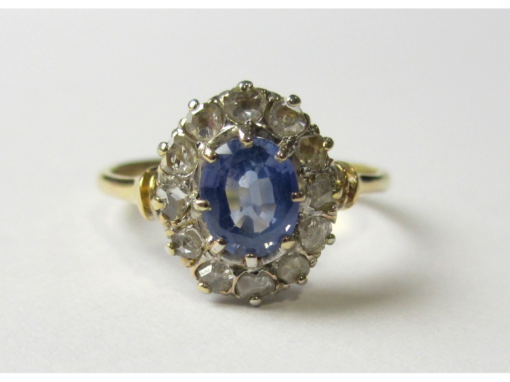 Appraisal: An ct gold Ceylon sapphire and diamond cluster ring with