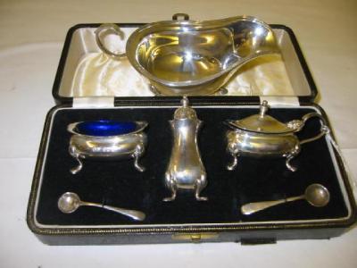 Appraisal: A THREE PIECE CONDIMENT SET of bellied oblong form with