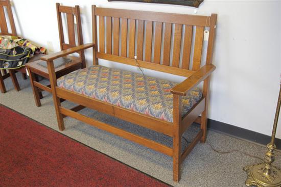 Appraisal: ARTS CRAFTS BENCH Oak with splat back polychrome upholstery and