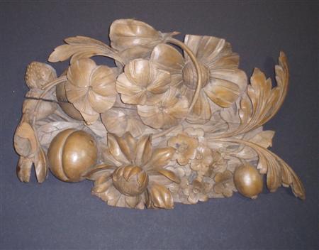 Appraisal: An ornate carved beech panel profusely decorated with flowers and