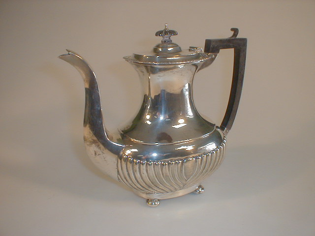 Appraisal: A George V silver coffee pot of part reeded form