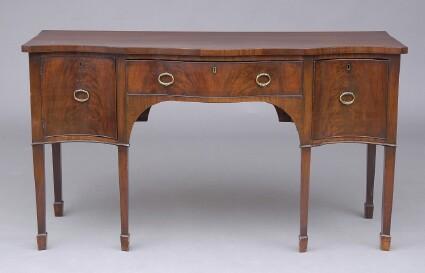 Appraisal: GEORGE III MAHOGANY SERPENTINE-FRONTED SIDEBOARD The arched kneehole case with