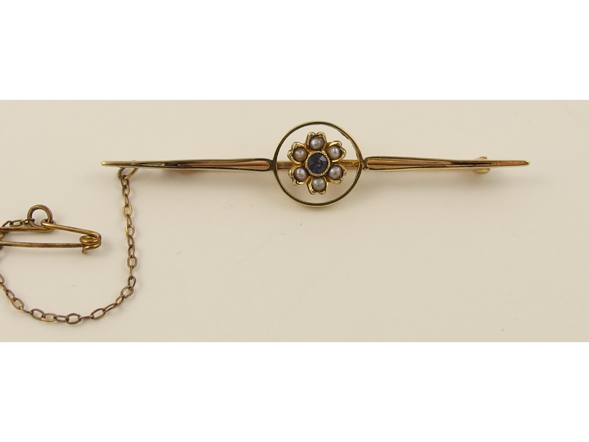 Appraisal: An Edwardian yellow metal bar brooch set with split pearls