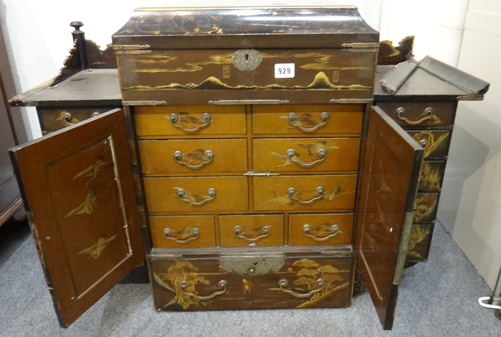 Appraisal: A Japanese lacquer cabinet Meiji period fitted with two central