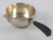 Appraisal: A Danish hand raised silver brandy warmer with beaded stiffened