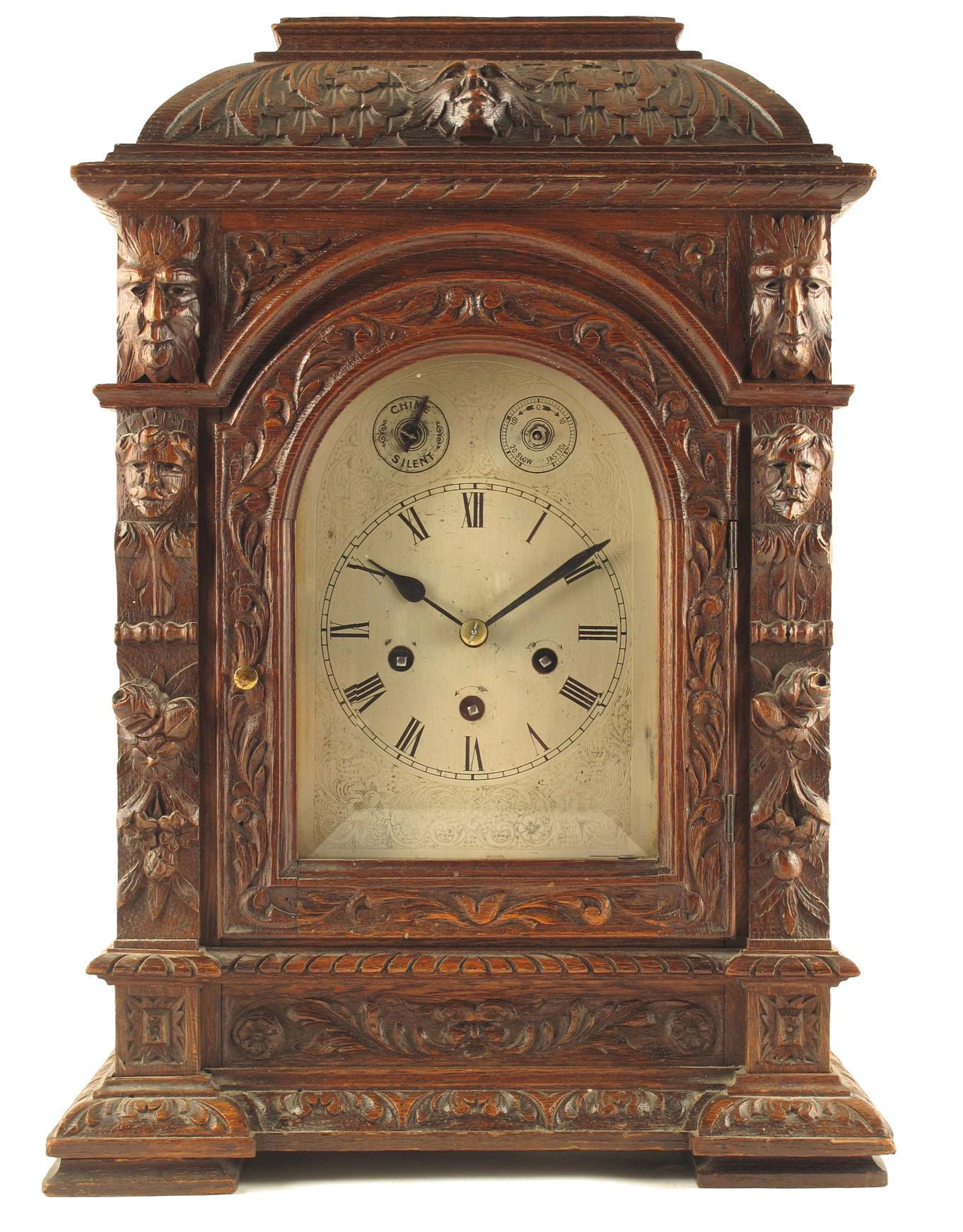 Appraisal: A carved oak hour chiming mantle clock