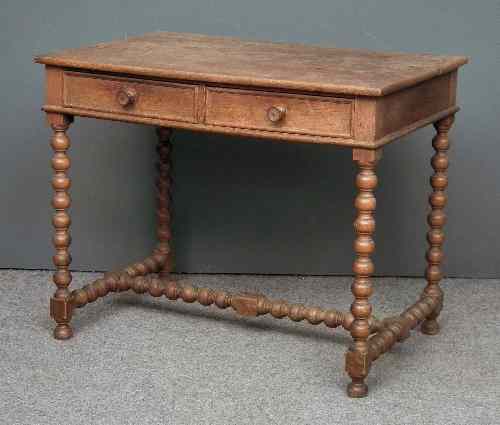 Appraisal: An oak side table of '' th Century'' design with