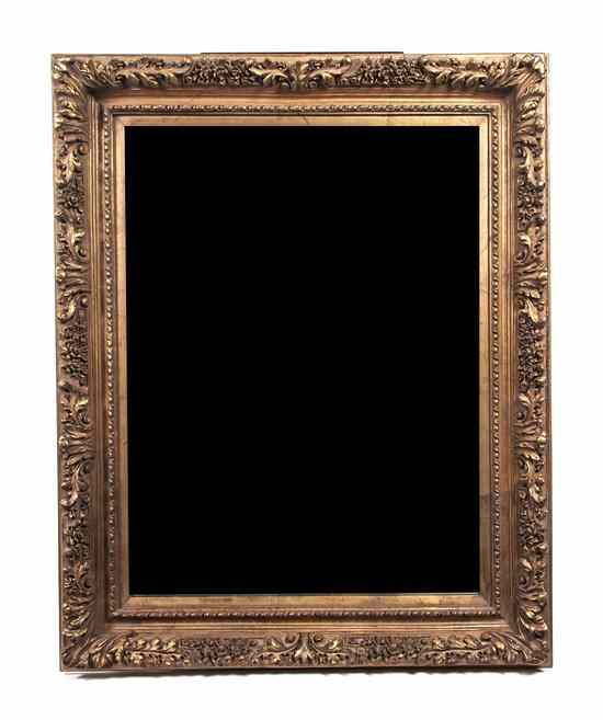 Appraisal: A Giltwood Over Mantel Mirror having a rectangular plate set