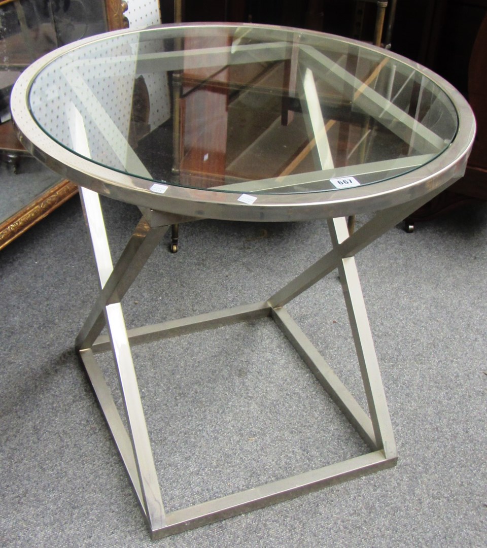 Appraisal: A th century circular chrome and glass occasional table on