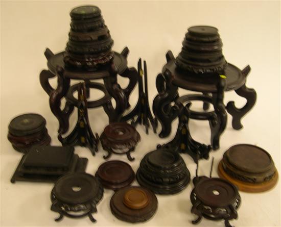 Appraisal: Assortment of Oriental wooden stands including a pair of footed