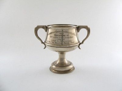 Appraisal: A presentation silver two-handled cup circular form scroll handles on