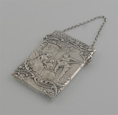 Appraisal: A Victorian card case stamped with a garden scene and