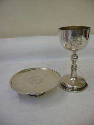 Appraisal: A VICTORIAN GOBLET the ovoid bowl chased with a sun