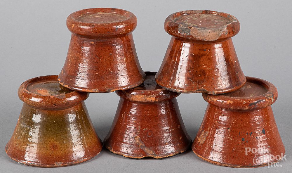 Appraisal: Five redware stove feet th c Five redware stove feet