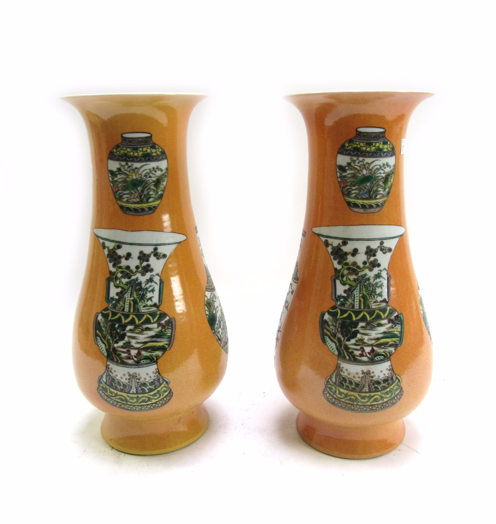 Appraisal: A pair of modern Chinese porcelain vases decorated with further