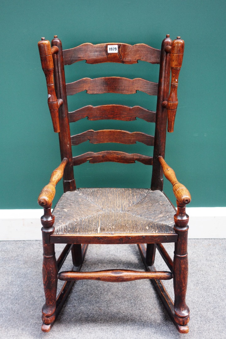 Appraisal: An early th century child's ash Lancashire ladder back rocking