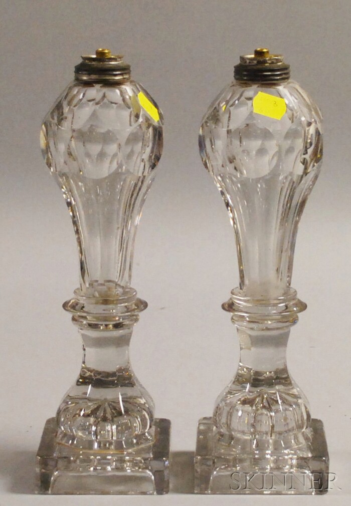 Appraisal: Pair of Sandwich Glass Co Attributed Colorless Glass Fluid Lamps