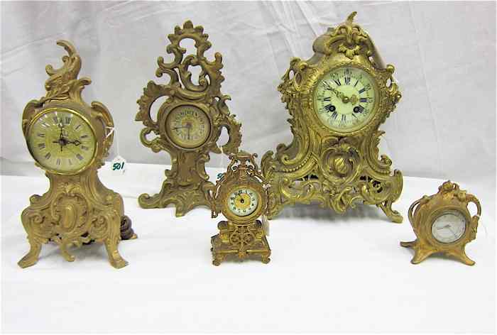 Appraisal: FIVE SMALL CAST METAL TABLE CLOCKS German alarm clock by